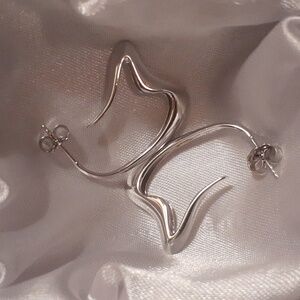 Rhodium over sterling silver earrings. BRAND NEW.